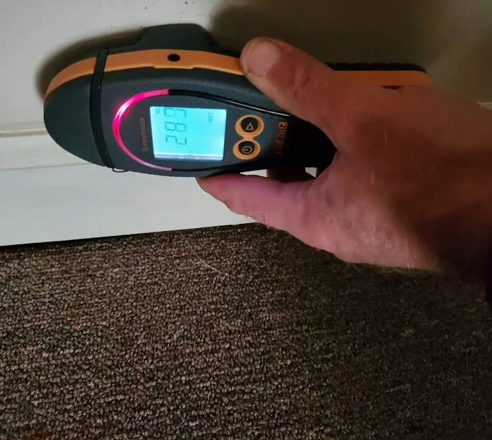 Moisture detection at baseboard during Storm Damage Restoration in Beacon Square